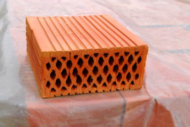 Closeup of perforated clay blocks clipart