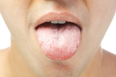 Closeup of young men shows tongue isolated on white background clipart