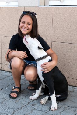 Happy girl with her four-legged friend clipart