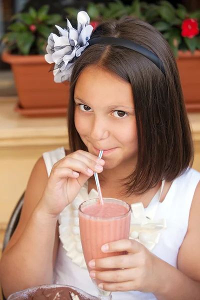 Lovely kid with cocktail in cafe — Stock Photo, Image