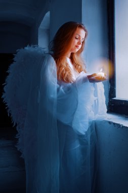 Angel with a candle clipart