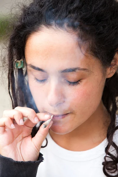 stock image Dramatic portrait of adolescent smoking