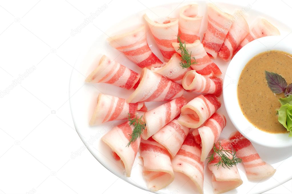 Bacon cut on a white dish