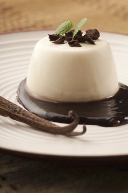 Panna Cotta with chocolate and vanilla beans clipart