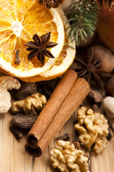 Different kinds of spices, nuts and dried oranges - christmas de — Stock Photo, Image