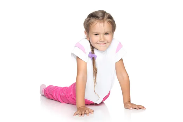 Beautiful Little Girl on white floor — Stock Photo, Image