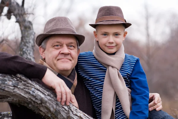 Grandfather and grandson outdoors. — Stock Photo, Image
