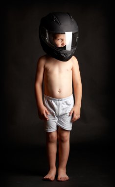 Boy with a helmet over black background clipart