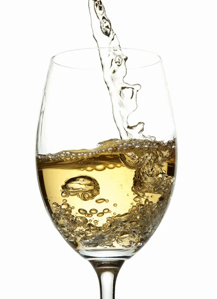 White wine pouring into glass — Stock Photo, Image