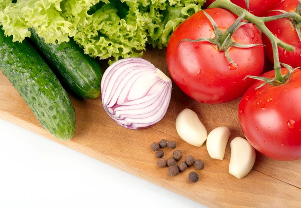 Verse groenten op houten hardboard — Stockfoto