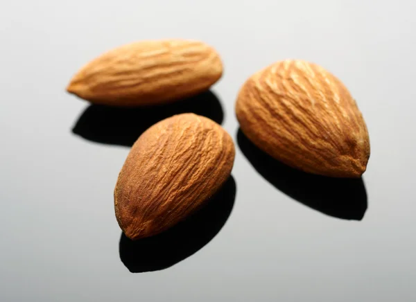 Almonds on black backgrond — Zdjęcie stockowe