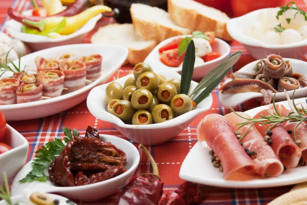 Pickled olives with other antipasto food — Stock Photo, Image