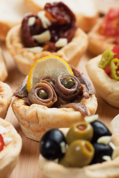 Anchovy rolls in bread cups — Stock Photo, Image