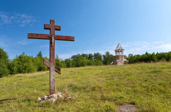 stock image Cross in honor of the basis of church and under construction orthodox churc