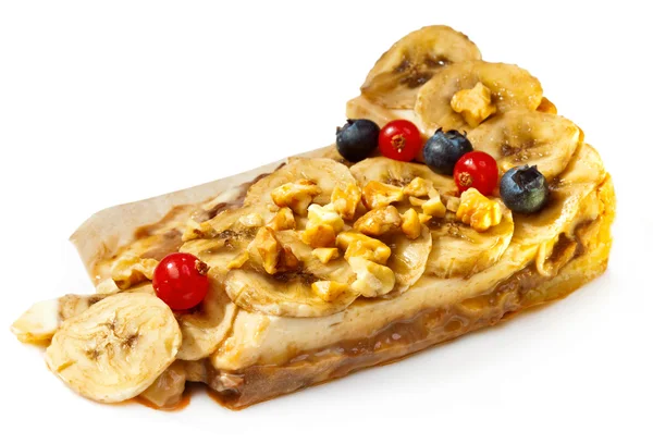 Banana dessert with nuts and berries — Stock Photo, Image