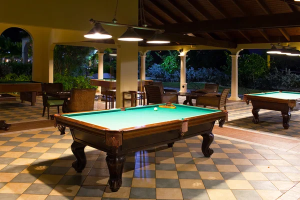 stock image Table for game in a pool on a street terrace, evening