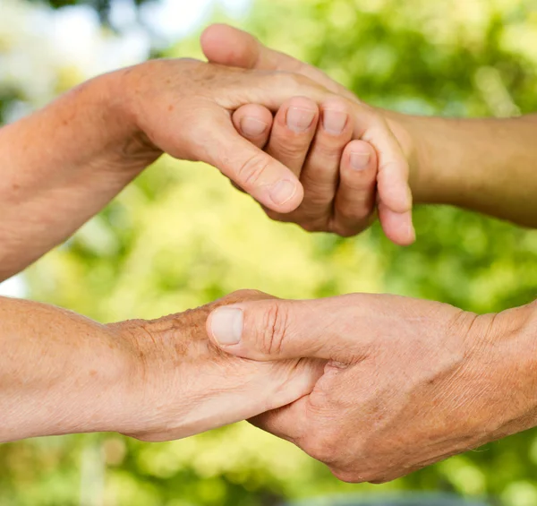 stock image Closeup of senior hands holding together