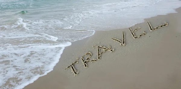 Travel drawn on sea beach — Stock Photo, Image