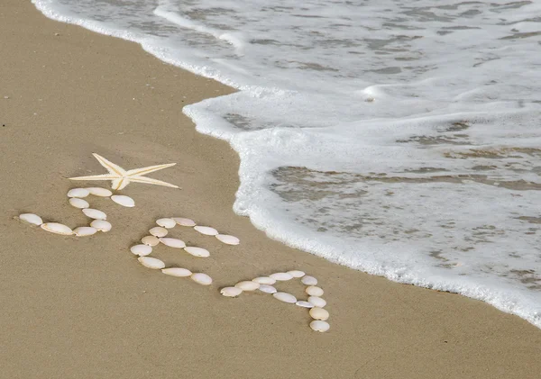 Wyraz "morze" na plaży — Zdjęcie stockowe