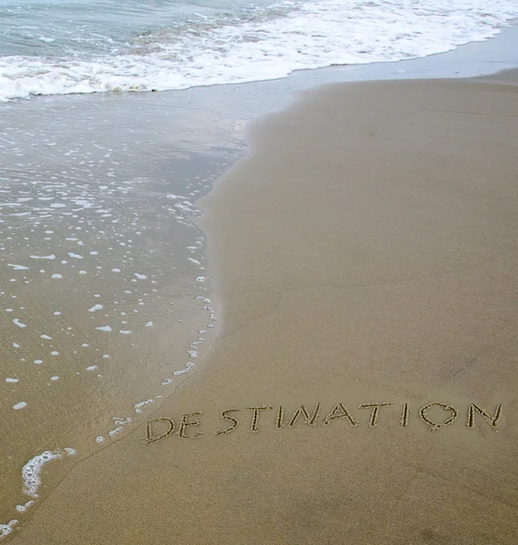 Word "destination" drawn on sea beach — Stock Photo, Image