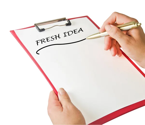 Writing fresh idea on clipboard — Stock Photo, Image