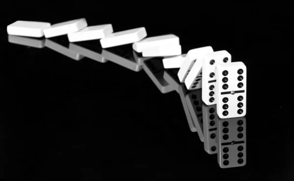 stock image Falling dominos in black and white