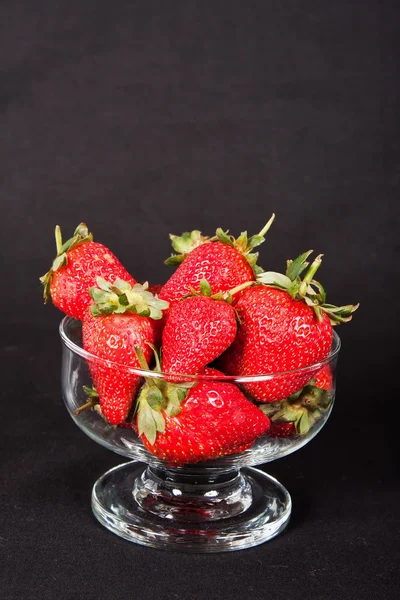 Red strawberries in a glass bowl — Stock Photo, Image