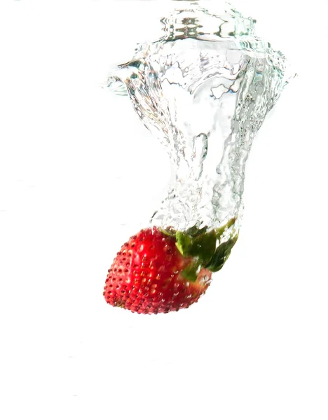 Strawberry dropped into water splash — Stock Photo, Image