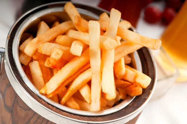 Fresh french fries on a bucket — Stock Photo, Image