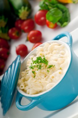 Mac and cheese on a blue little clay pot