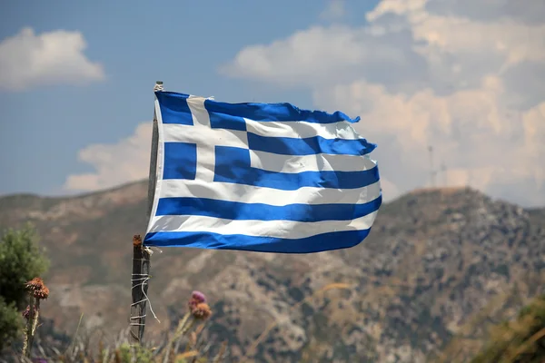 stock image The flag of Greece in a similar state as the economy