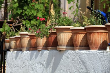 Long series of ceramic pots in the white stairs clipart