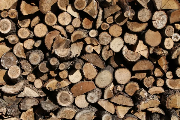 stock image Firewood arranged by the country cottage