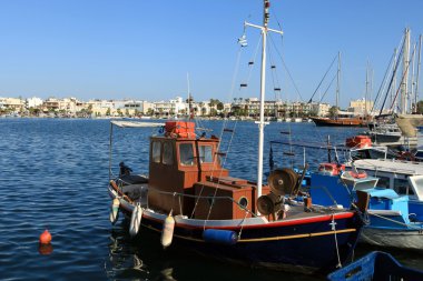 Wooden fishing boat in the port clipart