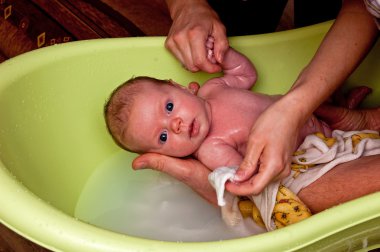 Infant in the bath clipart