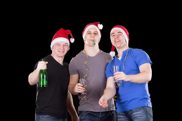 Três homens a usar chapéu de Pai Natal — Fotografia de Stock