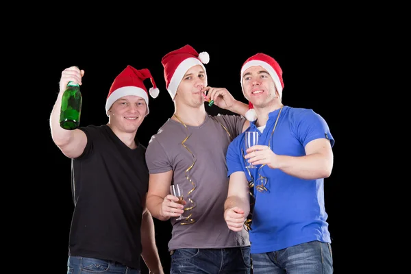Três homens a usar chapéu de Pai Natal — Fotografia de Stock
