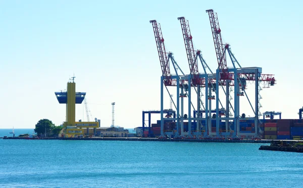 stock image Cranes in a port, waiting ships