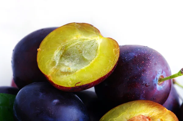 Fresh plums over white background — Stock Photo, Image