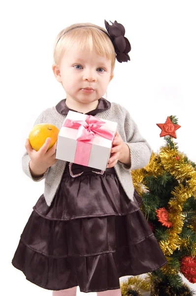 Little girl with Christmas tree and gifts — Stock Photo, Image