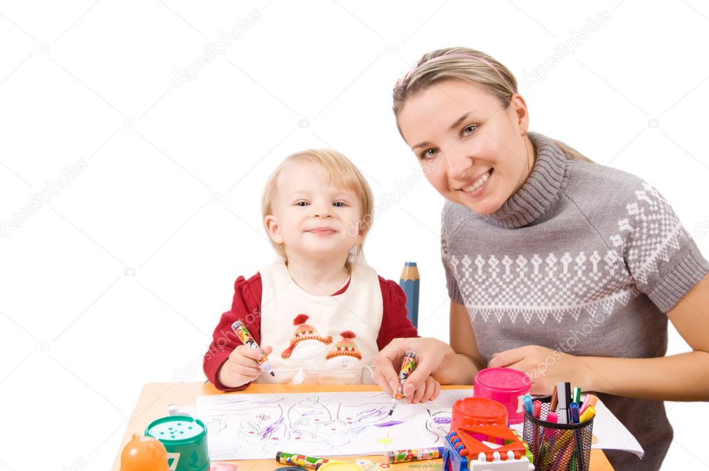 Girl drawing with her mother