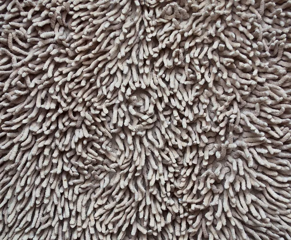 Een beige tapijt textuur — Stockfoto