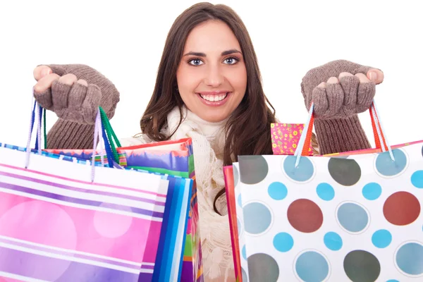 Vrouw duwen haar shopping tassen — Stockfoto