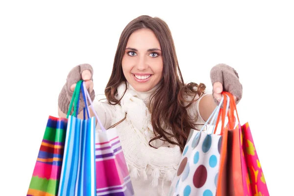 Mulher empurrando seus sacos de compras — Fotografia de Stock