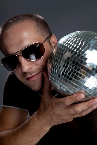 Handsome man with disco ball — Stock Photo, Image