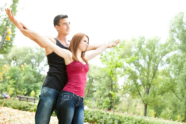 Couple with their arms outstretched — Stock Photo, Image