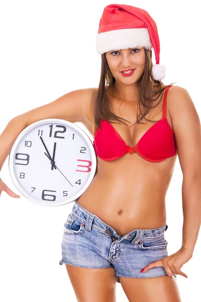 Santa flicka i underkläder håller klockan — Stockfoto