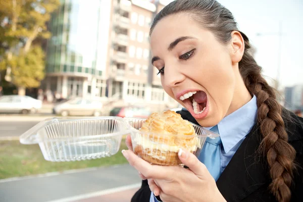 Hungry businesswoman — Stock Photo, Image