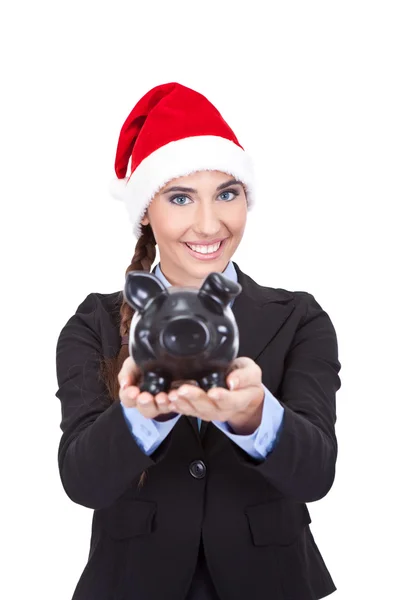 Empresária com chapéu de santa segurando banco porquinho — Fotografia de Stock