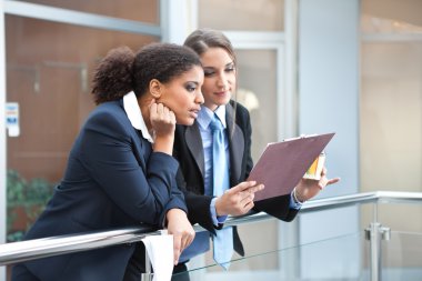 Two businesswomen talking about the job clipart